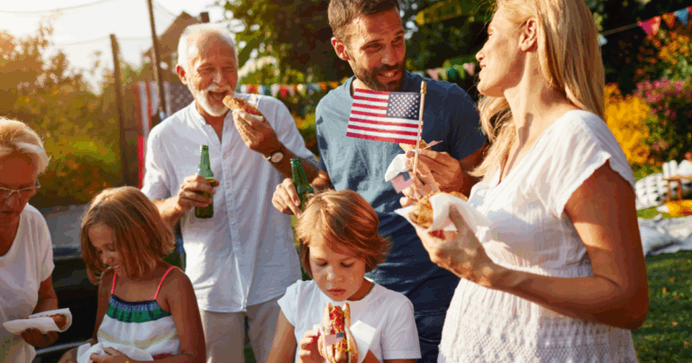 ALT Text Family Celebrating Fourth of July BBQ with Food, Drinks, and American Flags