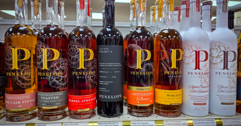 The Bourbon Secret Kansas City Collectors Don’t Want You to Know 1 Penelope Bourbon bottles on a shelf at Pina Wine and Spirits with visible pricing, including Toasted, Barrel Strength, Project X, and Wheated selections for Kansas City bourbon hunters abnd the best bourbon secret.