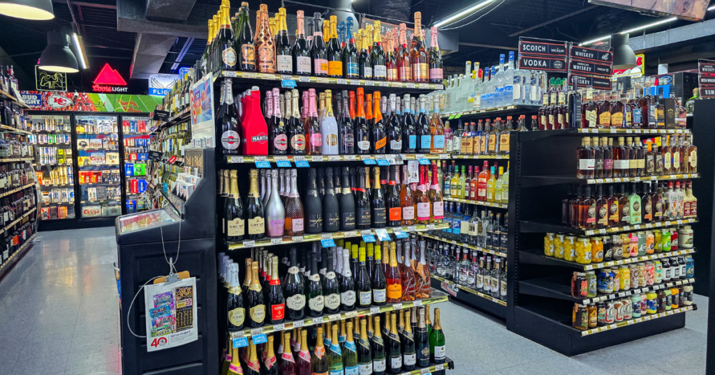 Liquor store aisle in Missouri featuring whiskey bottles, premium spirits, and beer coolers reflecting 2026 liquor trends including bourbon, ready to drink cocktails, and craft beverages.