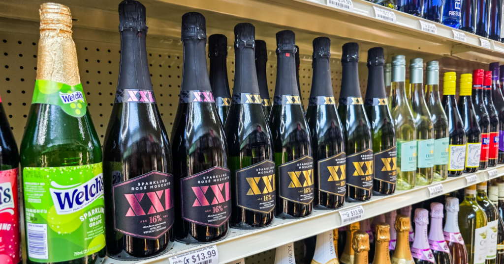 Sparkling wine and Moscato bottles on display at a Missouri wine store showcasing affordable fine wines and value wine selections.