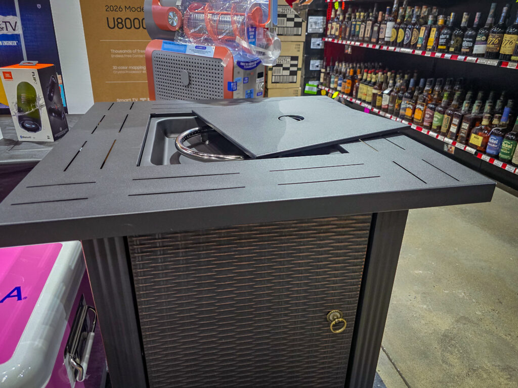 Firepit table raffle prize displayed at Pina Wine & Spirits Odessa.