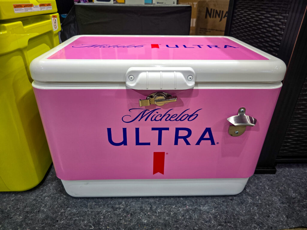 Pink Michelob Ultra cooler raffle prize displayed at Pina Wine & Spirits Odessa.