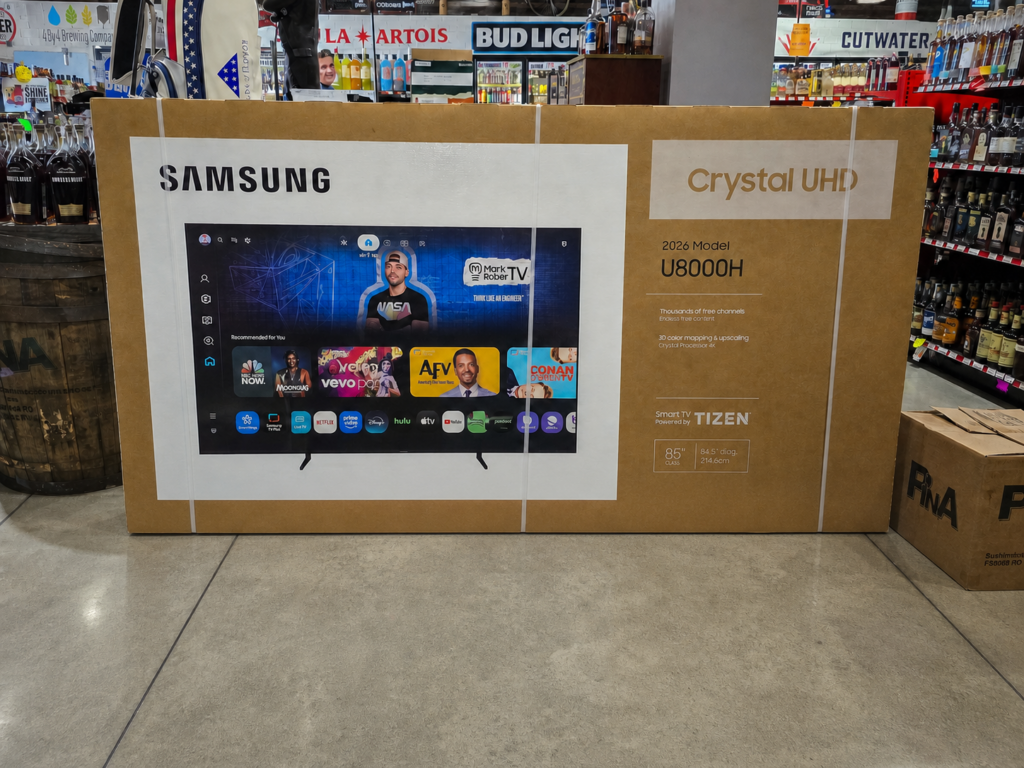 Samsung 85-inch Crystal UHD U8000H 4K Smart TV raffle prize box displayed at Pina Wine & Spirits Odessa.